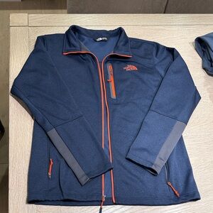 The North Face Men's Blue Jacket with Orange Accents